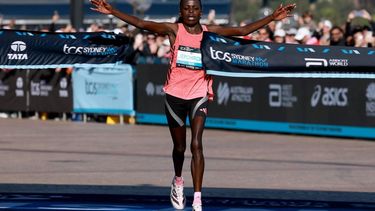 Kenya’s Peres Jepchirchir celebrates as she crosses the finish line to win the Women’s section of the 2026 Sydney Marathon in Sydney on August 30, 2026.  
DAVID GRAY / AFP