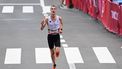Belgium's Koen Naert  arrives at the finish line in the men's marathon final during the Tokyo 2020 Olympic Games in Sapporo on August 8, 2021. 
Charly TRIBALLEAU / AFP