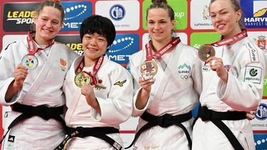 Silver medallist the Netherlands' Joanne Van Lieshout, gold medallist Japan's Haruka Kaju and bronze medallists Slovenia's Kaja Kajzer and Croatia's Iva Oberan celebrate during the medal ceremony for the women's under 63 kg event at the Tbilisi Grand Slam judo tournament in Tbilisi on March 21, 2026. 
Vano SHLAMOV / AFP