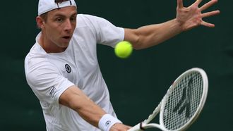 epa11455624 Tallon Griekspoor of the Netherlands in action against Miomir Kecmanovic of Serbia during their Mens Singles 2nd round match at the Wimbledon Championships, Wimbledon, Britain, 03 July 2024.  EPA/TIM IRELAND  EDITORIAL USE ONLY