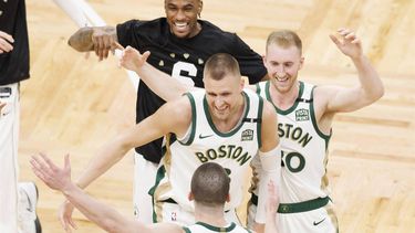 epa11140940 Boston Celtics guard Payton Pritchard is greeted by teammates Kristaps Porzingis (C) and Sam Hauser (R) during the second half of an NBA game between the Boston Celtics and the Washington Wizards in Boston, Massachusetts, USA, 09 February 2024.  EPA/CJ GUNTHER SHUTTERSTOCK OUT