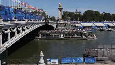 A tourist boat navigates on the Seine river under the Alexandre III bridge, after the first triathlon training session was cancelled during the Paris 2024 Olympic Games in Paris, on July 28, 2024, due to the pollution of the Seine river. The improved weather failed to prevent the first triathlon training session in the River Seine from being cancelled on July 28, 2024. Following a meeting 