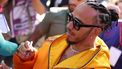 Mercedes' British driver Lewis Hamilton signs autographs for fans at the Albert Park Circuit ahead of the Formula One Australian Grand Prix in Melbourne on March 21, 2024. 
Martin KEEP / AFP