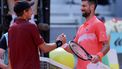 Italy's Matteo Arnaldi (L) shakes hands with Serbia's Novak Djokovic after winning the 2025 ATP Tour Madrid Open tennis tournament second round singles match at the Caja Magica in Madrid, on April 26, 2025. 
Thomas COEX / AFP