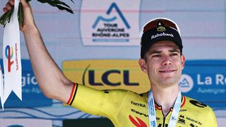 Stage winner Team Visma | Lease a Bike's Belgian rider Wout Van Aert celebrates on the podium of the 5th stage of the Tour Auvergne-Rhone-Alpes cycling race (formerly known as the Criterium du Dauphine), 195,8km between Saint-Chamond and Villars-les-Dombes, central France, on June 11, 2026. 
Anne-Christine POUJOULAT / AFP