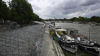 A general view shows stands under construction along the banks of the Seine River ahead of the upcoming Paris 2024 Olympics, in Paris on July 3, 2024. As part of the new phase of setting up infrastructure for the Games, which will take place from July 26 to August 11, 2024, the police headquarters has ordered the closure 