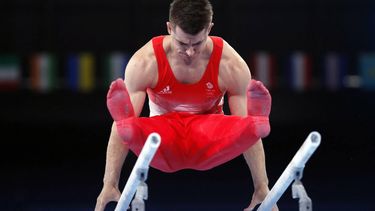 2021-07-24 14:41:47 epa09361192 Max Whitlock of Great Britain performs during the men's Parallel Bars Qualification of the Tokyo 2020 Olympic Games at the Ariake Gymnastics Centre in Tokyo, Japan, 24 July 2021.  EPA/TATYANA ZENKOVICH