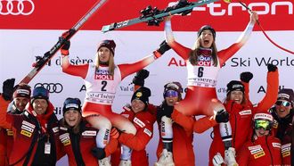 epa11032165 Second placed Joana Haehlen (CL) of Switzerland and winner Jasmine Flury (CR) of Switzerland celebrate with their team after the Women's Downhill race at the FIS Alpine Skiing World Cup in Val d'Isere, France, 16 December 2023.  EPA/GUILLAUME HORCAJUELO