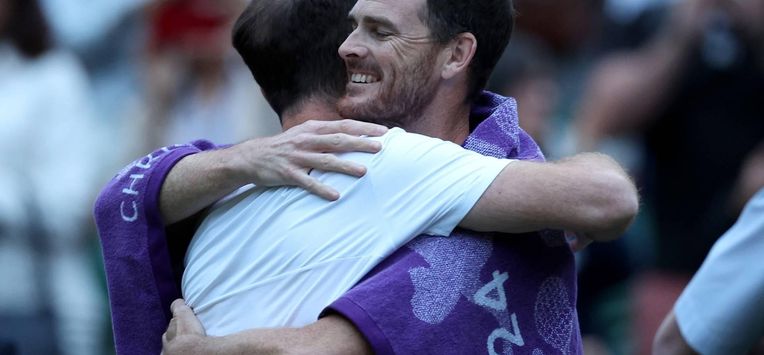 epa11457939 Jamie Murray of Britain (R) hugs his brother Andy Murray (L) after his post match interview following their loss in the Men's doubles 1st round match at the Wimbledon Championships, in Wimbledon, London, Britain, 04 July 2024.  EPA/ADAM VAUGHAN   EDITORIAL USE ONLY