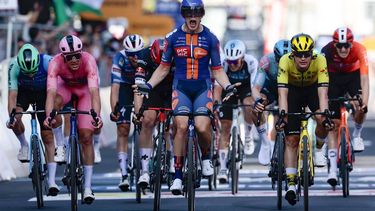 Team Picnic PostNL's Dutch rider Casper Van Uden (C) celebrates as he crosses the finish line of the 4th stage of the 108th Giro d'Italia cycling race 189kms from Alberobello to Lecce on May 13, 2025 
Luca Bettini / AFP