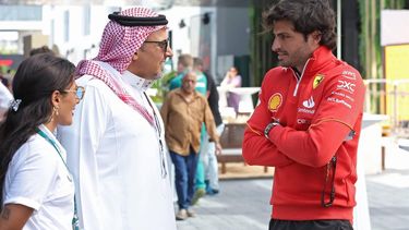 epa11202583 Spanish driver Carlos Sainz Jr (R) of Scuderia Ferrari talks to Saudi Automobile Federation president Khalid Bin Sultan Al Faisal (C) in the paddock in Jeddah, Saudi Arabia, 06 March 2024. The Formula 1 Saudi Arabia Grand Prix is held on 09 March 2024. Scuderia Ferrari announced Sainz was feeling unwell and had returned to the hotel.  EPA/ALI HAIDER