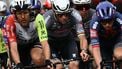 Dutch Mathieu Van Der Poel of team Alpecin-Deceuninck (C) and Dutch Taco Van Deer Hoorn (L) of team Intermarche ride in the pack during the Milan - Sanremo one-day classic cycling race, on March 22, 2025. 
Marco BERTORELLO / AFP