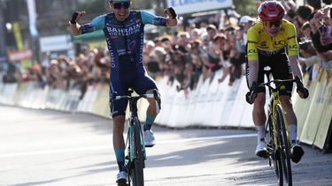 Bahrain - Victorious' French rider Lenny Martinez celebrates as he crosses crossing the finish ahead of Team Visma - Lease a Bike's Danish rider Jonas Vingegaard (R), to win the 8th and final stage of the Paris-Nice cycling race, 129.2 km between Nice and Nice, on March 15, 2026. 
Anne-Christine POUJOULAT / AFP
