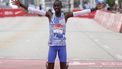 (FILES) Kenya's Kelvin Kiptum celebrates winning the 2023 Bank of America Chicago Marathon in Chicago, Illinois, in a world record time of two hours and 35 seconds on October 8, 2023.  World marathon record holder Kelvin Kiptum and his coach Gervais Hakizimana have died in a car crash in western Kenya that left a third passenger also injured, police said on February 11, 2024.
KAMIL KRZACZYNSKI / AFP
