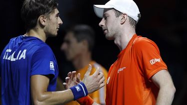 2023-11-23 13:48:27 epa10990763 Matteo Arnaldi (L) of Italy congratulates Dutch player Botic van de Zandschulp (R) following the latter's win in their match during the Davis Cup quarter final between Italy and the Netherlands at Martin Carpena pavilion in Malaga, Spain, 23 November 2023.  EPA/Jorge Zapata