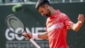 epa12128518 Novak Djokovic, of Serbia, reacts after losing a point to Cameron Norrie, of Britian, during a men's semifinal match at the Geneva Open tennis tournament in Geneva, Switzerland, 23 May 2025.  EPA/MARTIAL TREZZINI
