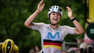 Movistar's German rider Liane Lippert, flanked by stage's 2nd placed, Yellow jersey of overall leader, SD Worx' Belgian rider Lotte Kopecky (L), celebrates as she crosses the finish line to win the second stage (out of 8) of the second edition of the Women's Tour de France cycling race 151 km between Clermont-Ferrand and Mauriac, in the Auvergne-Rhone-Alpes region, south-eastern France, on July 24, 2023. 
Jeff PACHOUD / AFP