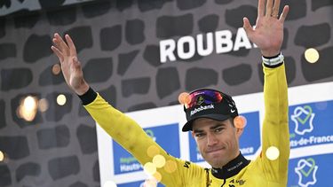 Winner Team Visma - Lease a Bike's Belgian rider Wout van Aert celebrates on the podium of the 123rd edition of the Paris-Roubaix one-day classic cycling race, 258.3 km between Compiègne and Roubaix, at the Vélodrome André-Pétrieux in Roubaix, northern France, on April 12, 2026. 
NICOLAS TUCAT / AFP