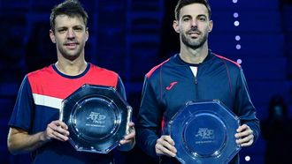 2023-11-19 16:32:26 Spain's Marcel Granollers (R) and Argentine's Horacio Zeballos pose with their trophy after being defeated by USA's Rajeev Ram and Great Britain's Joe Salisbury after the final at the ATP Finals tennis tournament in Turin on November 19, 2023.
 
Tiziana FABI / AFP