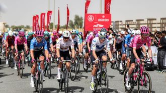 Riders launch from the start line during the first stage of the UAE Tour cycling event from Madinat Zayed Majlis to Liwa Palace in Abu Dhabi on February 16, 2026. 
Fadel SENNA / AFP