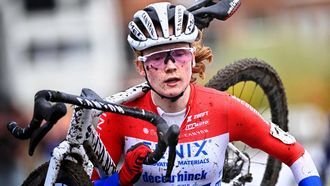 Dutch rider Puck Pieterse carries her bike as she competes in the women's elite race at the 'Urban Cross Kortrijk' cyclocross cycling event, the second stage in the X2O Badkamers 'Trofee Veldrijden' competition, in Kortrijk on November 25, 2023. 
JASPER JACOBS / Belga / AFP