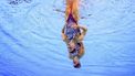 An underwater view shows Netherlands' Bregje De Brouwer and Netherlands' Noortje De Brouwer competing in the duet technical routine of the artistic swimming event during the Paris 2024 Olympic Games at the Aquatics Centre in Saint-Denis, north of Paris, on August 9, 2024. 
Oli SCARFF / AFP