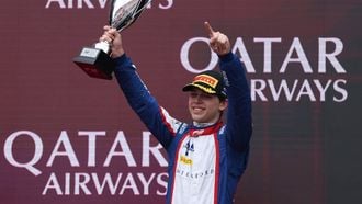Third-placed Trident driver Laurens van Hoepen of the Netherlands celebrates on the podium after the Round 1 Melbourne Feature Race of the Formula 2 Championship at Albert Park Circuit on March 8, 2026, ahead of the Formula One Australian Grand Prix. 
Martin KEEP / AFP