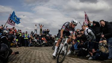 Alpecin-Deceuninck's Dutch rider Mathieu van der Poel cycles in a breakaway leading the race at the Carrefour de l'Arbre, a cobblestone road, during the 122nd edition of the Paris-Roubaix one-day classic cycling race, 259,2 km between Compiegne and Roubaix, northern France on April 13, 2025. 
JEFF PACHOUD / AFP