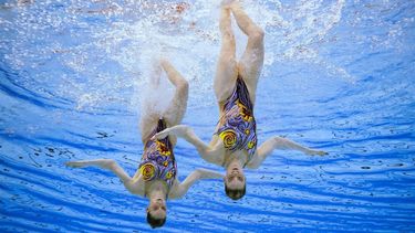Netherlands' Bregje De Brouwer and Noortje De Brouwer compete in the preliminary round of the women's duet free Group B artistic swimming event during the 2024 World Aquatics Championships at Aspire Dome in Doha on February 7, 2024. 
OLI SCARFF / AFP