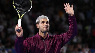 epa12409428 Carlos Alcaraz of Spain celebrates after winning his round of 16 match against Zizou Bergs of Belgium (not pictured) at the Japan Open tennis tournament at Ariake Colosseum in Tokyo, Japan, 27 September 2025.  EPA/RODRIGO REYES MARIN