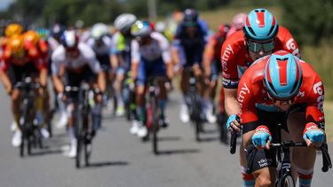 2023-07-14 15:54:56 Lotto Dstny's Belgian rider Victor Campenaerts (front) and Lotto Dstny's Dutch rider Pascal Eenkhoorn (2nd R) cycle ahead of the pack of riders during the 13th stage of the 110th edition of the Tour de France cycling race, 138 km between Chatillon-sur-Chalaronne in central-eastern France and Grand Colombier, in the Jura mountains, in France, on July 14, 2023. 
Thomas SAMSON / AFP