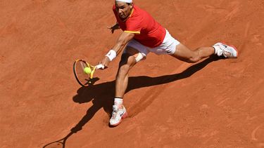 (FILES) Spain's Rafael Nadal returns to Serbia's Novak Djokovic during their men's singles second round tennis match on Court Philippe-Chatrier at the Roland-Garros Stadium at the Paris 2024 Olympic Games, in Paris on July 29, 2024.  Rafael Nadal announced on October 10, 2024 he will retire from professional tennis after the Davis Cup finals in November, ending a career in which he won 22 Grand Slam titles and Olympic singles gold.
Miguel MEDINA / AFP