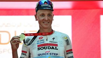 Team Soudal Quick-Step Belgian rider Tim Merlier celebrates on the podium after winning the fifth stage of the UAE Tour cycling race between the American University and the Hamdan bin Mohammed Smart University in Dubai on February 21, 2025. 
Giuseppe CACACE / AFP