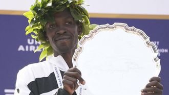 Men's division winner Albert Korir Kenya poses on the podium after the 2021 TCS New York City Marathon in New York on November 7, 2021. After a forced break in 2020, the New York City Marathon is back on for its 50th edition, and with it the countless opportunities to run it for charity, an industry that has become a staple, and hopes to take off again after the pandemic.
TIMOTHY A. CLARY / AFP