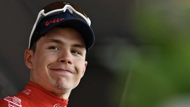 2023-07-23 02:00:00 Belgium's Arnaud De Lie of Lotto-Dstny wearing the red jersey of best young rider reacts after winning  stage 2 of the Tour De Wallonie cycling race, 179,6 km from Saint-Ghislain to Walcourt, on July 23, 2023. 
JOHN THYS / Belga / AFP