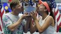 2023-09-09 18:33:57 Kazakhstan's Anna Danilina (R) and Finland's Harri Heliovaara kiss their trophy after defeating USA's Jessica Pegula and Austin Krajicek during the US Open tennis tournament mixed doubles final match at the USTA Billie Jean King National Tennis Center in New York City, on September 9, 2023. 
TIMOTHY A. CLARY / AFP