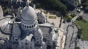 (FILES) A picture taken on July 14, 2017, in Paris shows an aerial view of the Basilica of the Sacred Heart (Basilique du Sacre-Coeur) located at the summit of the butte Montmartre.   The final stage of the Tour de France will make three circuits of the historic district of Montmartre on its final stage, organisers of the world's greatest bike race confirmed on May 21, 2025.
JEAN-SEBASTIEN EVRARD / AFP