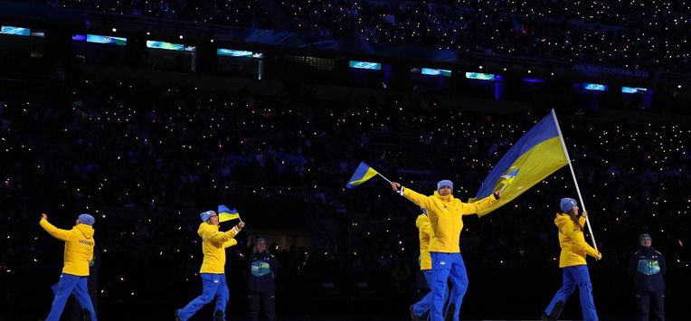 Flagbearer Yelyzaveta Sydorko of Team Ukraine leads the team in the athletes' parade during the opening ceremony of the Milano Cortina 2026 Winter Olympics at San Siro Stadium on February 06, 2026 in Milan, Italy. 
Sarah Stier / POOL / AFP