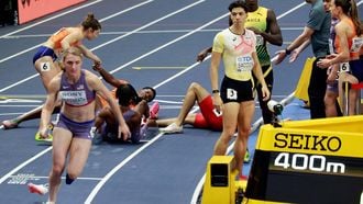 Netherlands' Keenan Blake is seen on the floor after a handover in the 4 x 400m relay final during the World Athletics Indoor Championships Kujawy Pomorze 2026 in Torun, Poland on March 21, 2026. 
Wojtek RADWANSKI / AFP