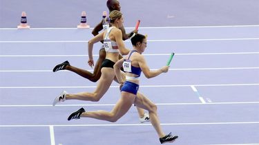 epa11519973 (top to bottom) Shamier Little of the USA, Marika Popowicz-Drapala and Louise Maraval of France compete in the 4x400m Relay Mixed heats in the Athletics competitions in the Paris 2024 Olympic Games, at the Stade de France stadium in Saint Denis, France, 02 August 2024.  EPA/RONALD WITTEK