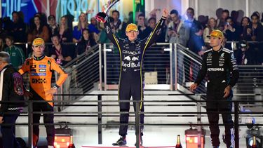 Race winner Red Bull Racing's Dutch driver Max Verstappen (C) celebrates with second place finisher McLaren's British driver Lando Norris (L) and third place finisher Mercedes' British driver George Russell (R) on the podium after the Las Vegas Formula One Grand Prix at the Las Vegas Strip Circuit in Las Vegas, Nevada, on November 22, 2025. Formula One world champion Max Verstappen produced a masterful drive to win the Las Vegas Grand Prix on Saturday as McLaren's Lando Norris finished second to edge closer to a maiden drivers' title.
Red Bull ace Verstappen pounced on a slip by pole-sitter Norris on the first turn of Sin City's street circuit to grab the lead and controlled the race thereafter to claim the 69th Grand Prix win of his career, finishing more than 20 seconds clear.

Frederic J. Brown / AFP