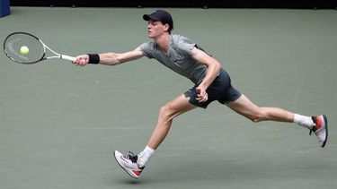 Italy's Jannik Sinner plays a return to Australia's Christopher O'Connell during their men's singles third round match on day six of the US Open tennis tournament at the USTA Billie Jean King National Tennis Center in New York City, on August 31, 2024. 
Kena Betancur / AFP