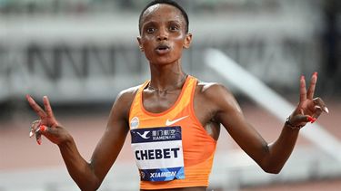 Kenya's Beatrice Chebet celebrates after winning in the women's 3000m final during the IAAF Diamond League athletics meeting at Egret Stadium in Xiamen, in China’s eastern Fujian province on September 2, 2023. 
GREG BAKER / AFP