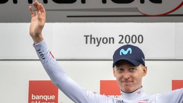 Britain's Max Poole celebrates on the podium wearing the white jersey of the best young rider after the fourth stage of the Tour de Romandie UCI cycling World tour, 161,6 km from Sion to Thyon, on April 29, 2023. 
Fabrice COFFRINI / AFP
