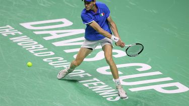Jannik Sinner of Team Italy returns a shot to Alex de Minaur of Team Australia during their semi-final singles match between Italy and Australia at the Davis Cup Finals at the Palacio de Deportes Jose Maria Martin Carpena arena in Malaga, southern Spain, on November 23, 2024. 
Thomas COEX / AFP
