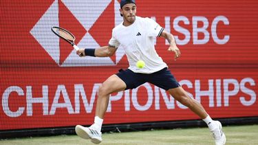 Argentina's Francisco Cerundolo returns to US player Tommy Paul during the men's singles final tennis match on day six of the ATP HSBC Championships at Queen's Club in west London on June 21, 2026. 
Henry NICHOLLS / AFP