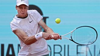 Italy's Jannik Sinner returns the ball to Russia's Karen Khachanov during the fourth round of the 2024 ATP Tour Madrid Open tournament tennis match at Caja Magica in Madrid on April 30, 2024. 
Thomas COEX / AFP