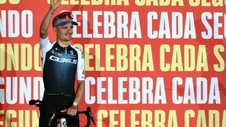 Team Q36.5's British rider Thomas Pidcock waves during the official teams presentation of the 80th edition of 'La Vuelta' cycling tour of Spain, in Torino, Italy on August 21, 2025. 
Marco BERTORELLO / AFP