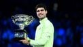 epa12697298 Carlos Alcaraz of Spain poses with the trophy after winning the Men’s Singles final match against Novak Djokovic of Serbia at the Australian Open tennis tournament in Melbourne, Australia, 01 February 2026.  EPA/JOEL CARRETT AUSTRALIA AND NEW ZEALAND OUT