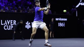 Spain's Carlos Alcaraz of Team Europe returns the ball to USA's Taylor Fritz of Team World during their 2024 Laver Cup men's singles tennis match in Berlin, Germany on September 22, 2024. 
Odd ANDERSEN / AFP